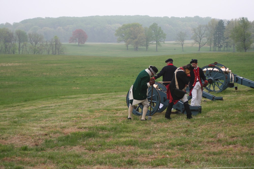 The artillery crew takes the position of fire for the salute.