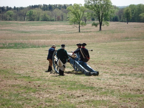 Cannon crews preparing for an artillery firing demonstration in celebration of French Alliance Day.