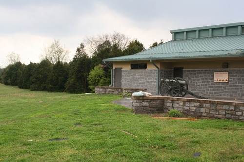 A stuffed bunny and other debris litters the back patio of the visitor center.