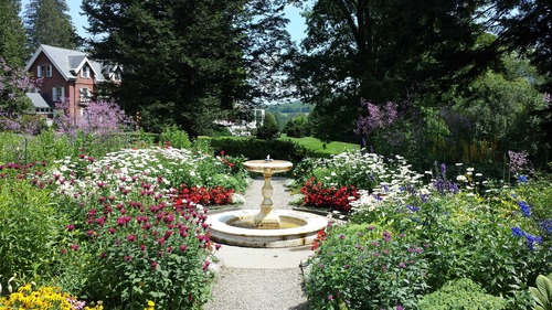 Marsh-Billings-Rockefeller NHP Formal Gardens & Mansion in full bloom in summer.