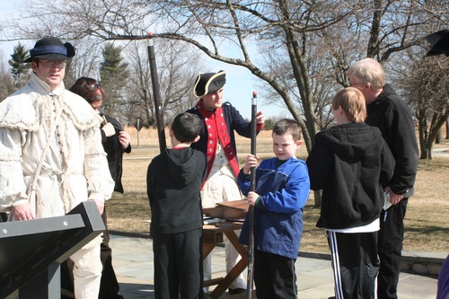 Junior Rangers muster into the Continental Army. Ranger Pete and Private Mike look on.