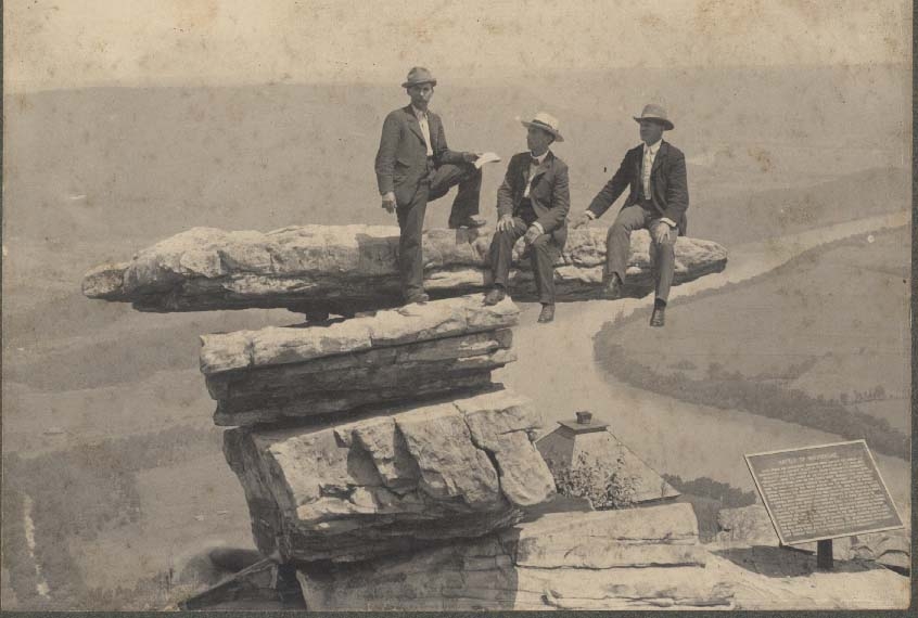 Jim Bolander, Chas Bolander and Ed Myers all from Marion, Ohio, posed on Umbrella Rock in 1908. The roof of the Point Hotel is visible beneath the bluff.