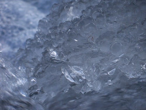 Tsenesdghaas Na' flows through granulated ice. Denali National Park, AK.