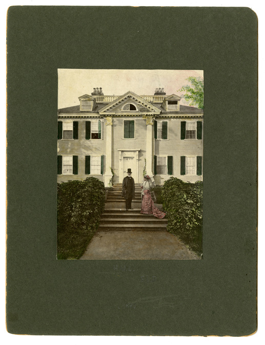 Man in suit and top hat and woman in pink dress with train on steps in front of Georgian mansion