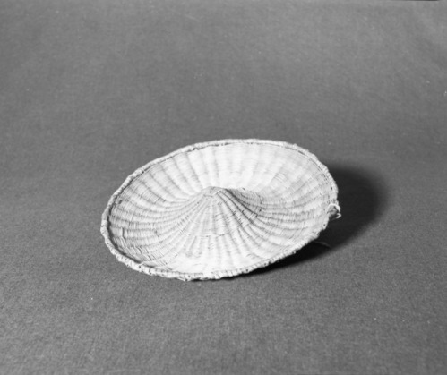 Marie Rozier Collection, Catalog No. 270. Object: Hopi wicker plaque. Dimensions: 12 x 1 1/2". Materials: rabbit bush, yucca, commercial dyes. Technology: wicker technique throughout. Collection History: Gift of Anne Conger. Photographed by Michael Dixon, December 1982. Catalogued by Craig Bates and Barbara Beroza. Yosemite Collections, National Park Service. Marie Rozier Collection.