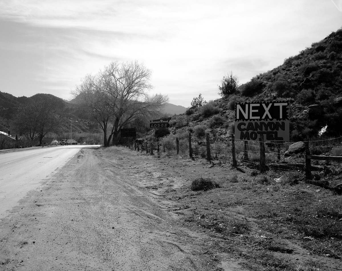 Roadside signs in Springdale. Canyon Motel, Terrace Brook Lodge, Allred's Cafe.