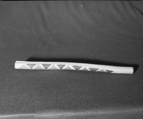 Marie Rozier Collection, Catalog No. 203. Object: Miwok clapstick. Dimensions: 20". elderberry, commercial paints. Collection History: Made by Craig Bates in 1970, patterned after those used by Bill Franklin, a northern Miwok from Ione, at that time. Photographed by Michael Dixon in December 1982. Catalogued by Craig Bates and Barbara Beroza. Yosemite Collections, National Park Service.