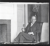 FL Olmsted, Jr. sitting in the parlor at Fairsted