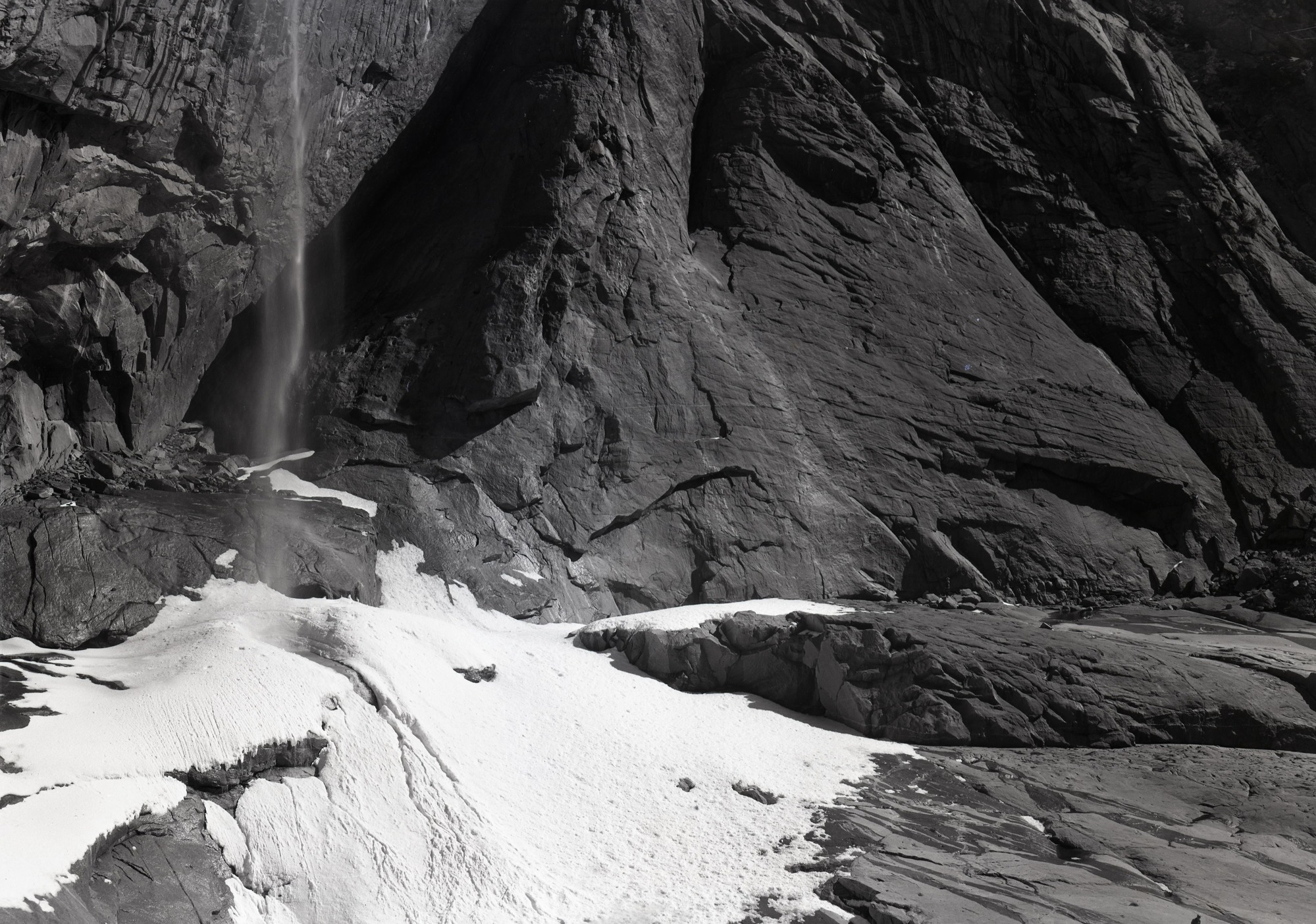 Cliff walls around ice cone at foot Yosemite Fall.