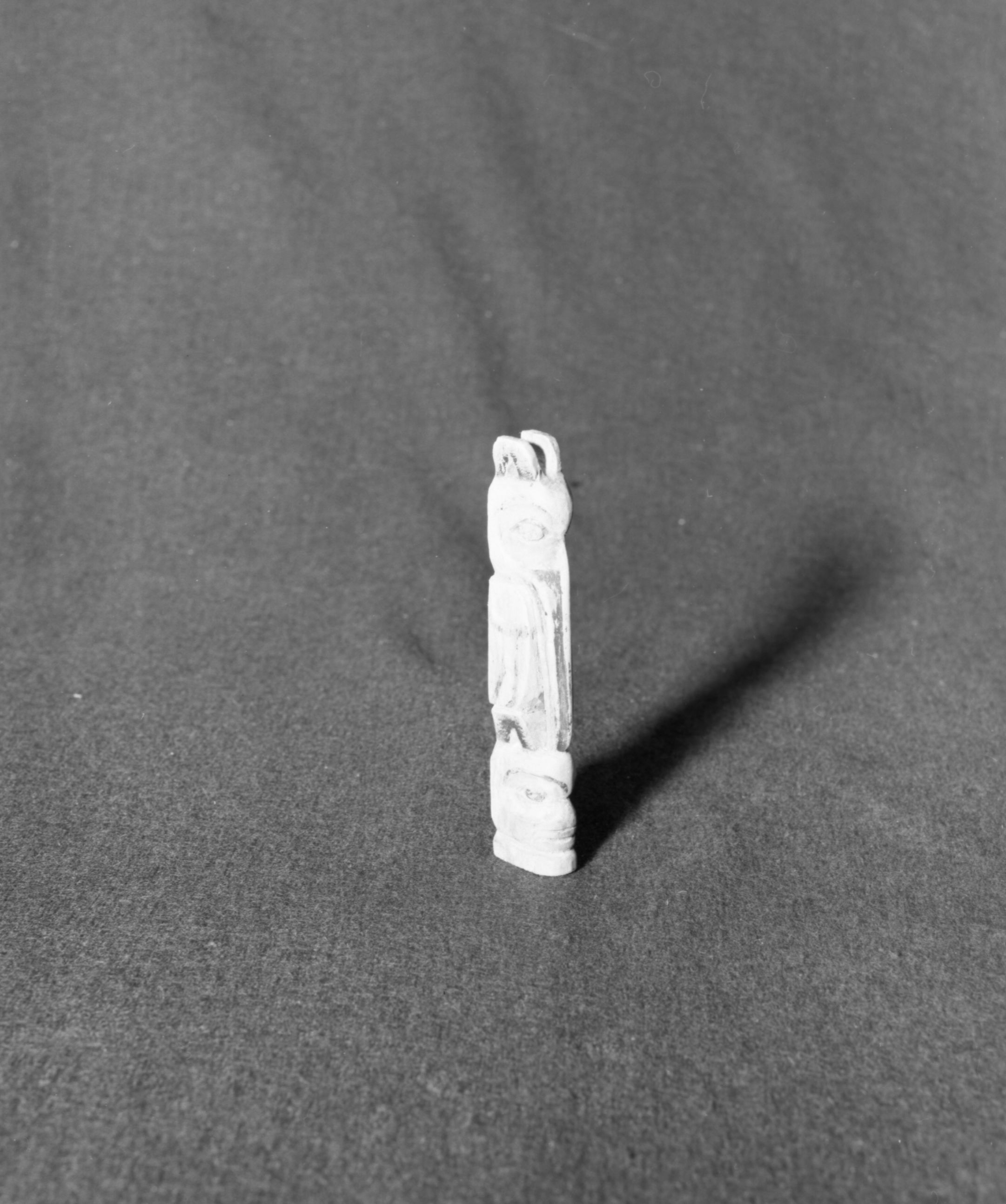 Marie Rozier Collection, Catalog No. 245. Object: Model totem pole. Dimensions: 5 1/2". Materials: Wood, paint. Collection History: Gift of Trezila Payton Daoust. Photographed by Michael Dixon in December 1982. Catalogued by Craig Bates and Barbara Beroza. Yosemite Collections, National Park Service.