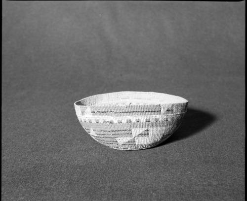 Marie Rozier Collection, Catalog No. 130. Object: Yurok/Karok/Hupa hat. Dimensions: 7 x 3". Materials: Conifer root, maidenhair fern stems, beargrass, woodwardia fern dyed with alder bark. Collection History: Mrs. Long collection, collected between 1890 and 1910. Photographed by Michael Dixon in December 1982. Catalogued by Craig Bates and Barbara Beroza. Yosemite Collections, National Park Service.
