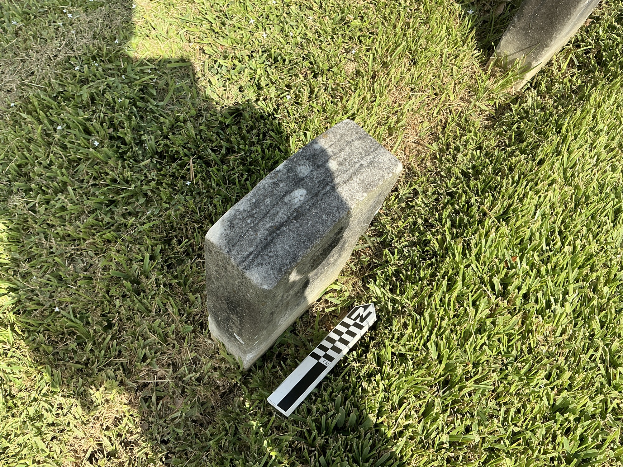 Extra image of historic upright marble headstone with recessed shield face.