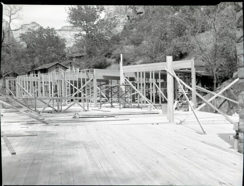 Rebuilding Zion Lodge after fire of January 28, 1966 - walls and ceilings of much of lodge in place.