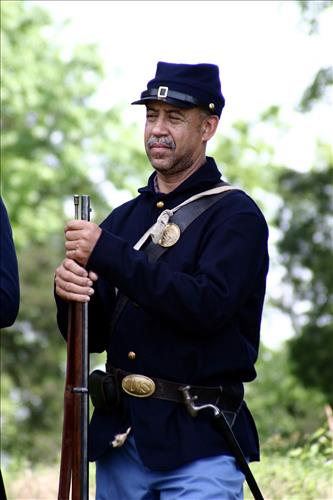 Portaits of Civil War interpreters of U.S. Colored Troops with their rifles at Stones River National Battlefield, April 2004