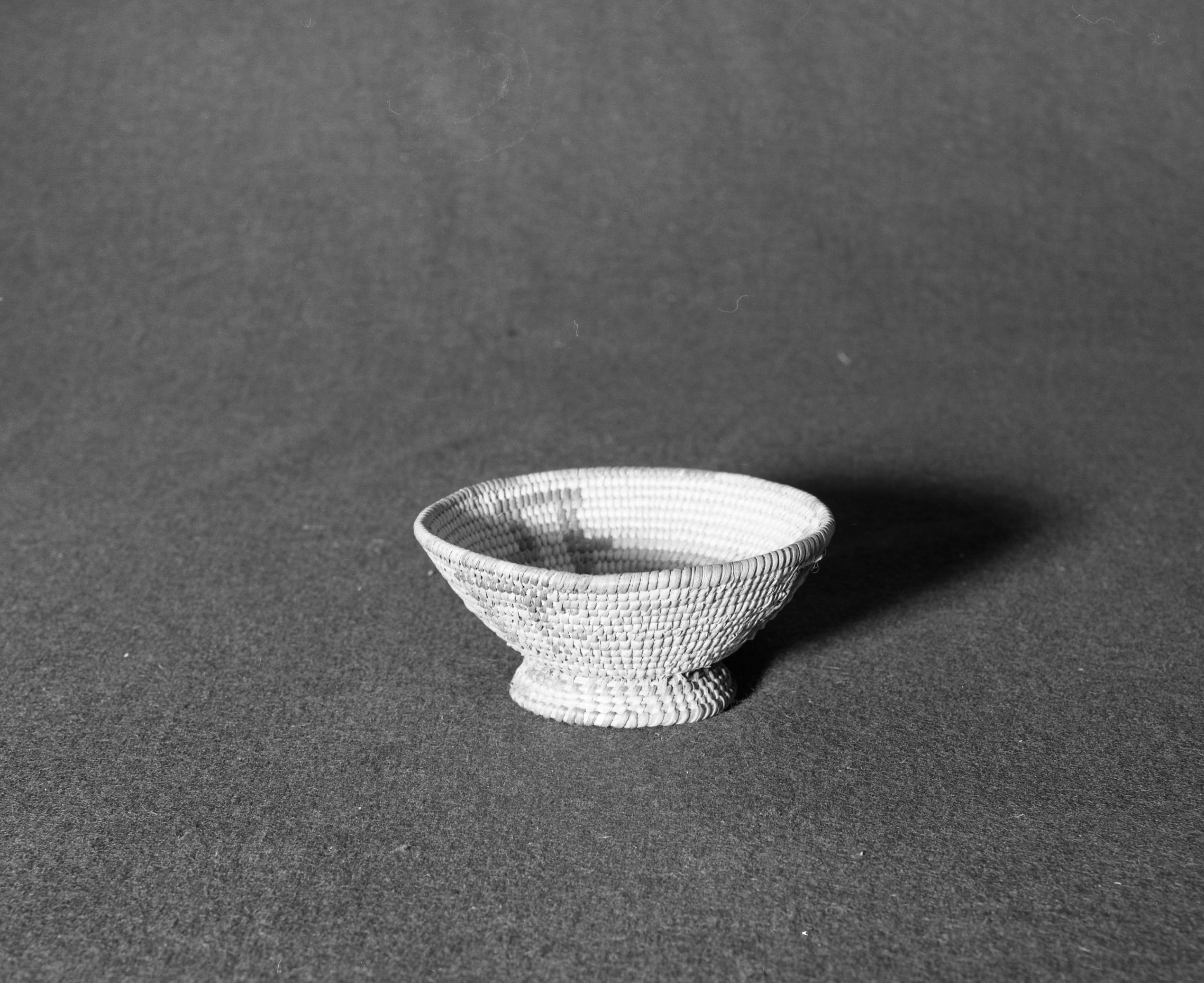 Marie Rozier Collection, Catalog No. 163. Object: Pima basket. Dimensions: 2 1/2 x 5 1/4". Materials: willow, devil's claw, cattail stem. Technology: pedestal base, made for tourists. Collection History: ---. Photographed by Michael Dixon, Dec. 1982. Catalogued by Craig Bates and Barbara Beroza. Yosemite Collections, National Park Service.