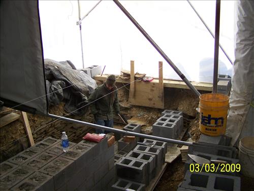 HPTC Day Labor Craftsmen laying stonework for the HAFE Park west arsenal foundation stabilization, Harpers Ferry Lower Town, February 17, 2009.