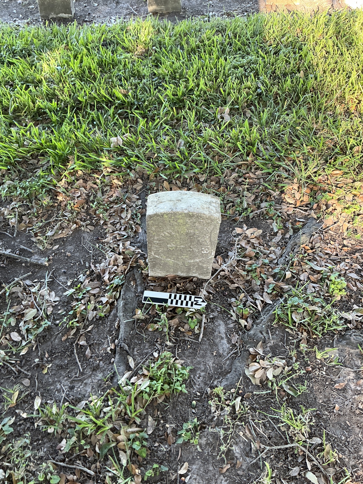 Extra image of historic upright marble headstone with recessed shield face.