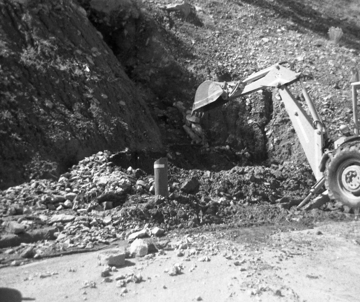 BW photos of rock slides in Kolob Canyons - 110mm. Backhoe clearing debris from roadway.