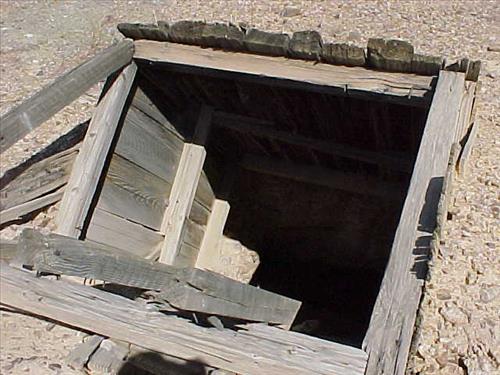 Open shafts and adits at Paymaster Mine, an abandoned gold mine in July 2004.