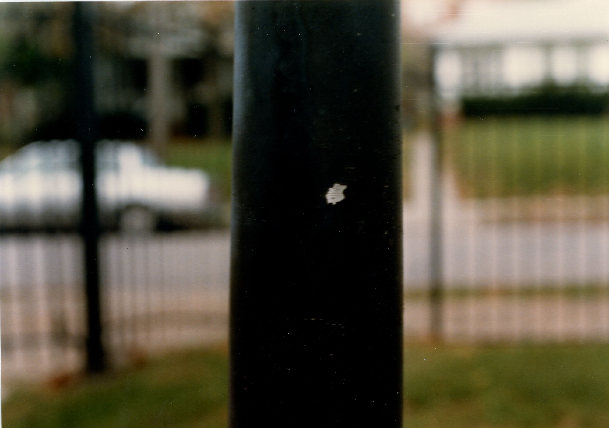 Gas lamp in front yard- white dot where paint was scraped off post by NPS