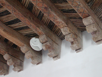 The ceiling is made of wood.