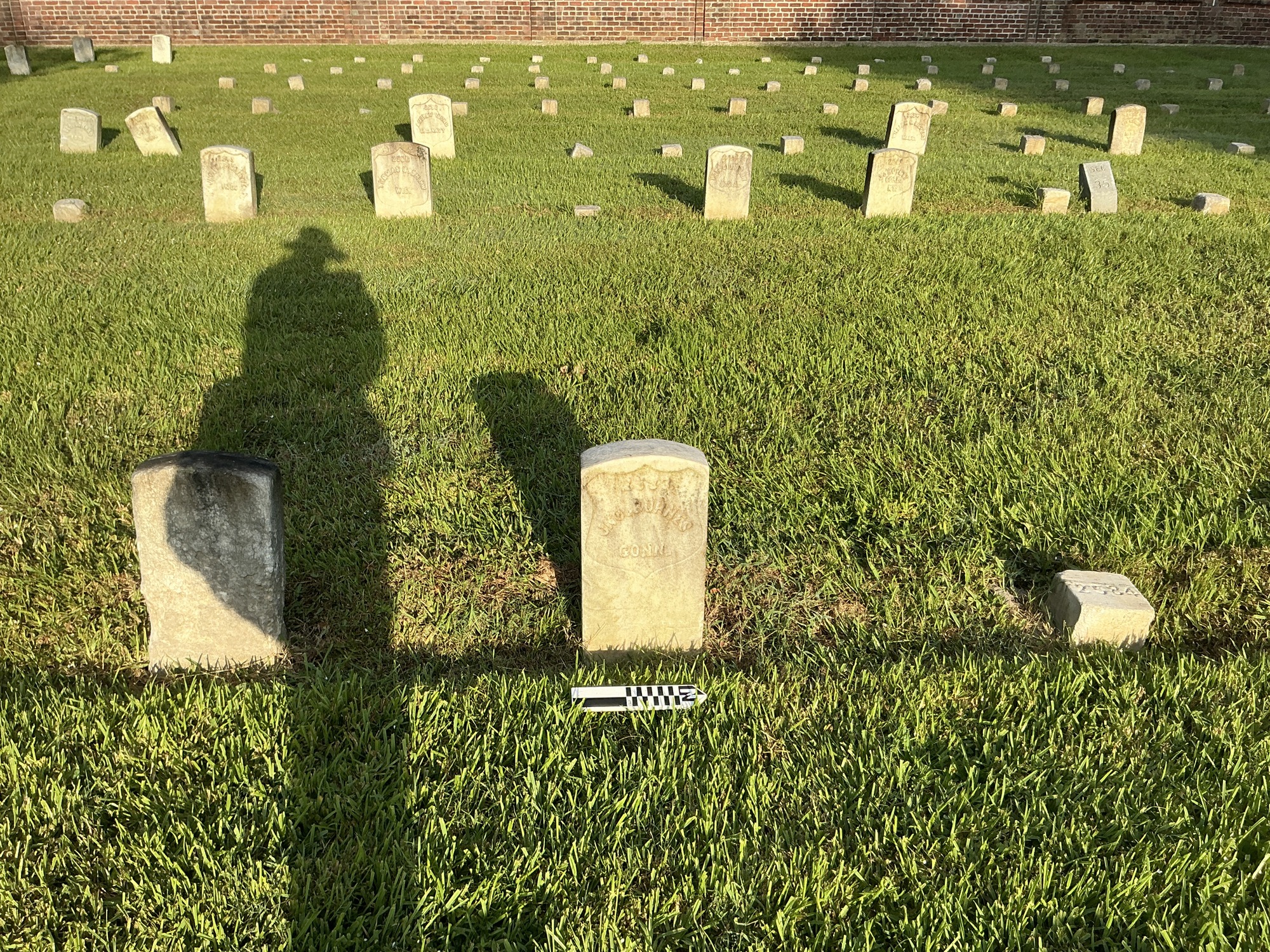 Extra image of historic upright marble headstone with recessed shield face.