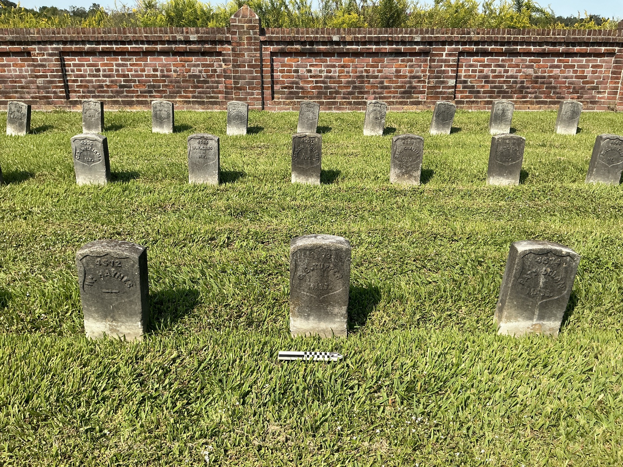 Extra image of historic upright marble headstone with recessed shield face.
