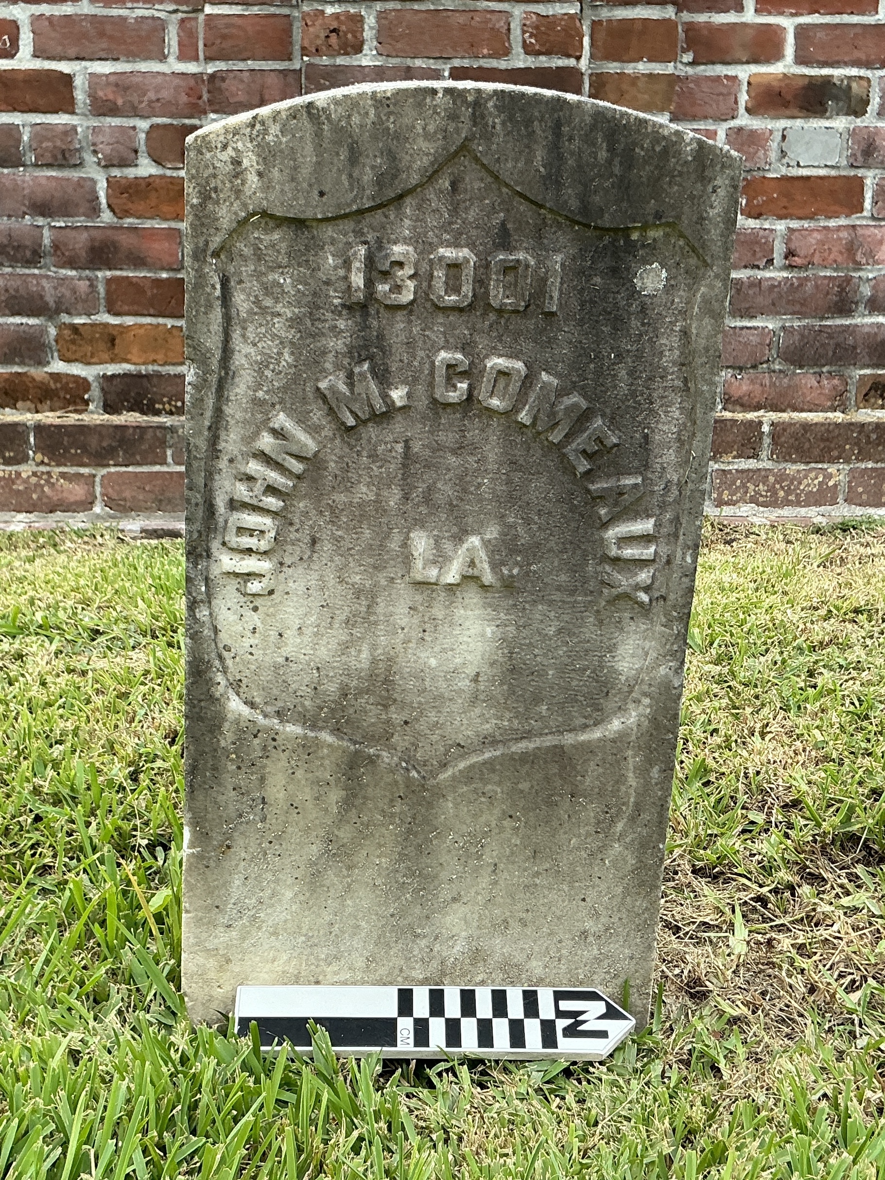 Extra image of historic upright marble headstone with recessed shield face.