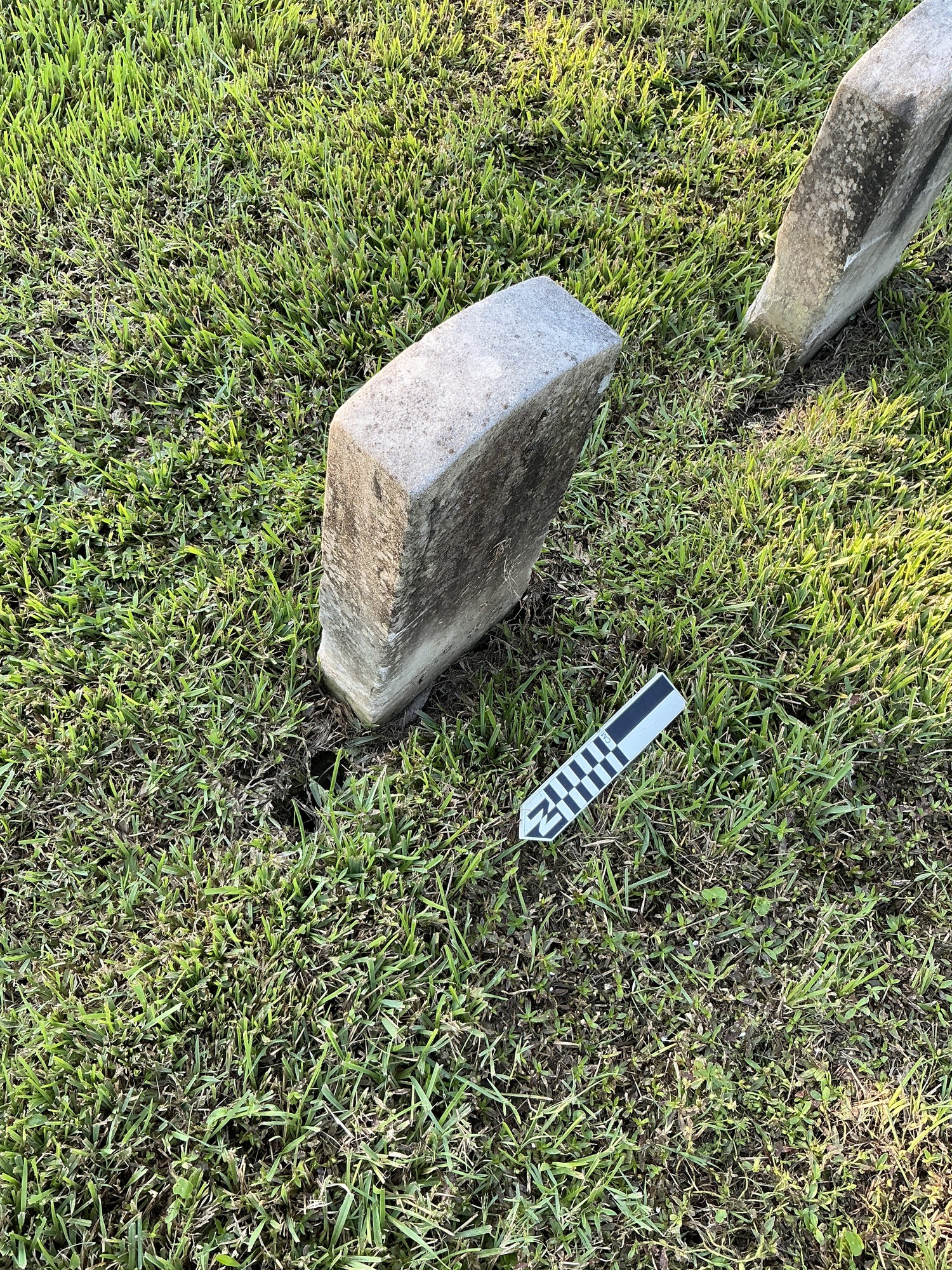 Extra image of historic upright marble headstone with recessed shield face.