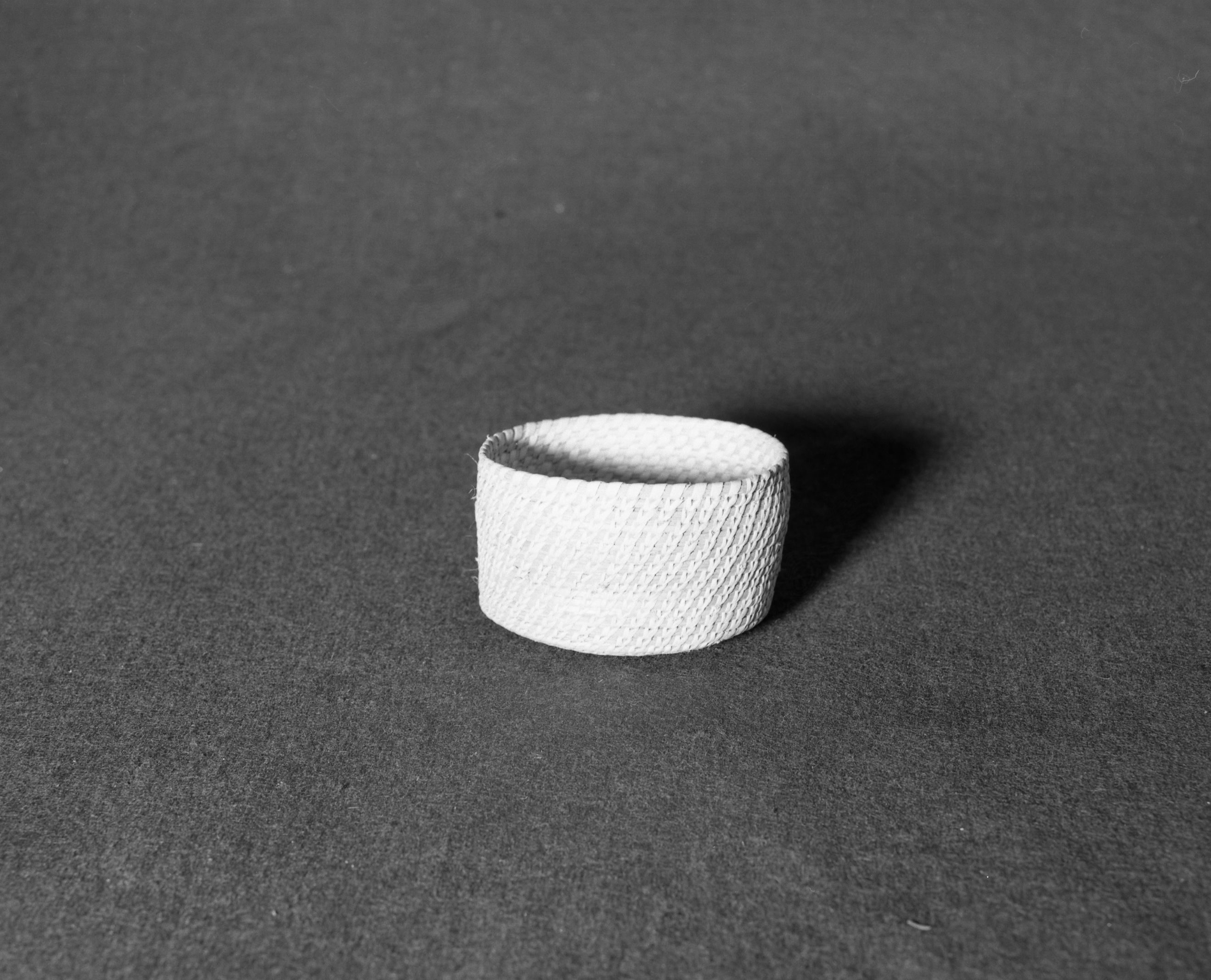 Marie Rozier Collection, Catalog No. 98. Object: Papago basket. Dimensions: 4 x 2 1/2". Materials: yucca. Technology: split stitched. Collection History: Purchased by Mary Long. Photographed by Michael Dixon, Dec. 1982. Catalogued by Craig Bates and Barbara Beroza. Yosemite Collections, National Park Service.