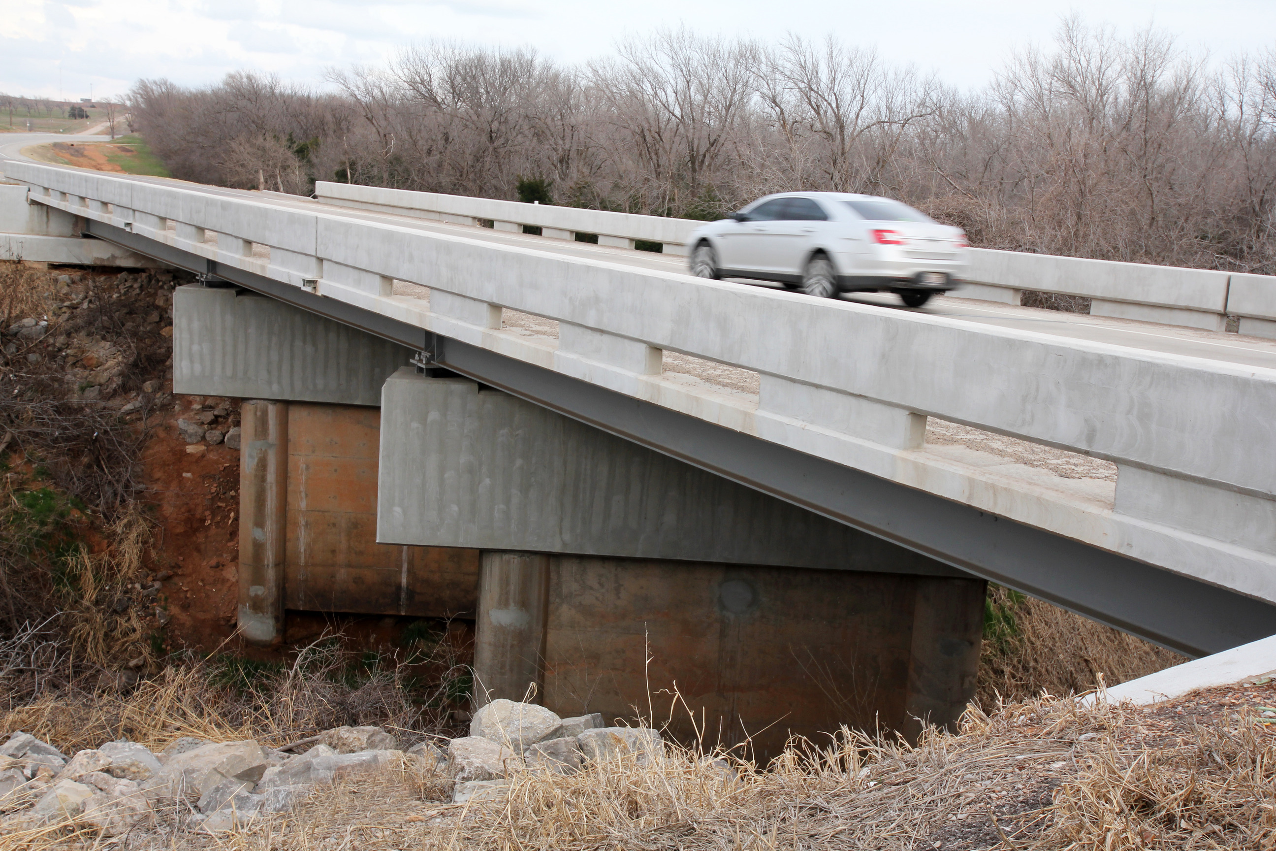 Bridges on Turtle Creek on 4-lane alignment at E. end of Clinton.