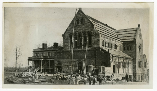 Black and white photo of Hamilton Grange standing next to a newly erected St. Luke's Church, with the church undergoing construction.