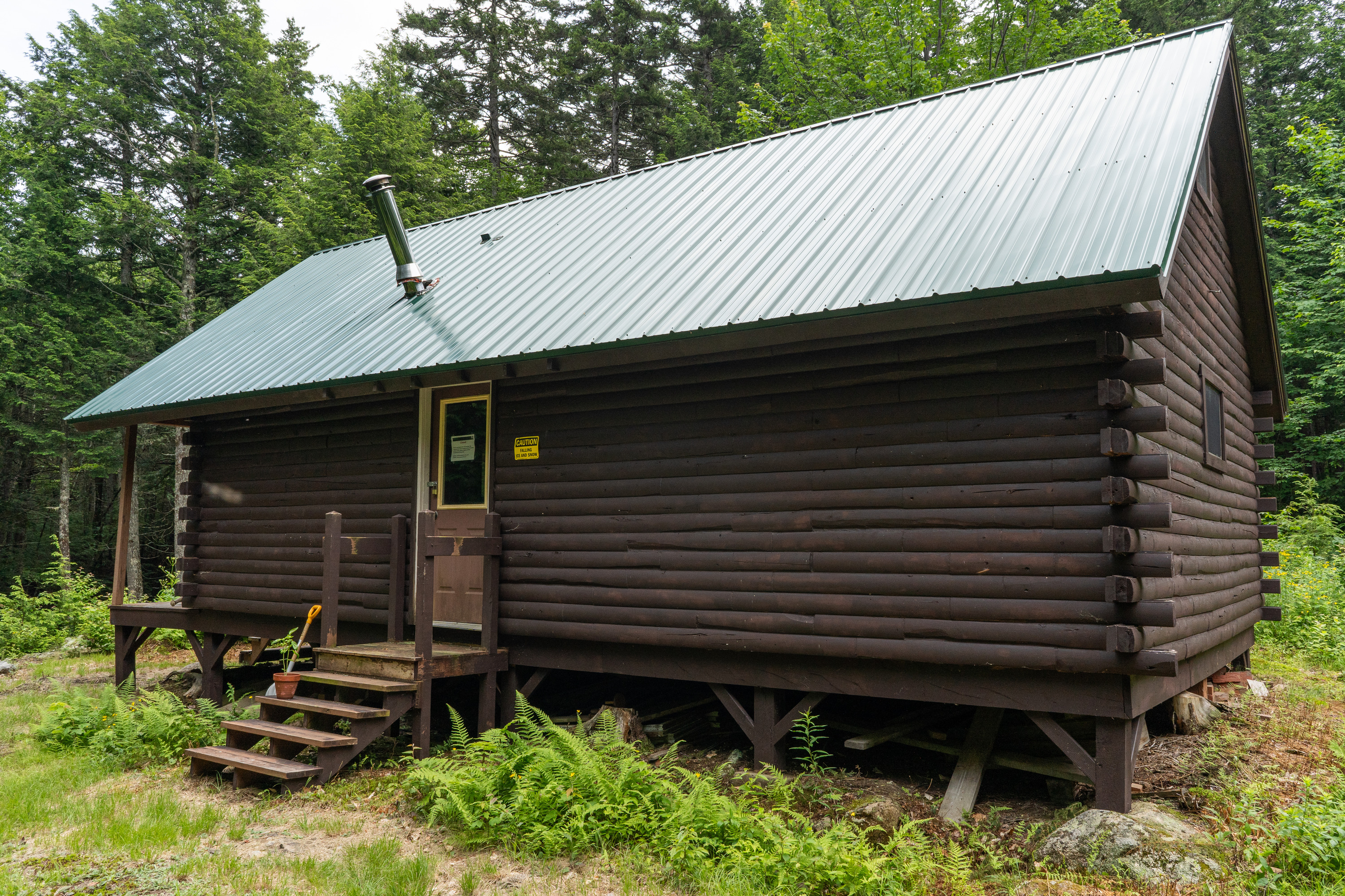 Exterior view of a log cabin.