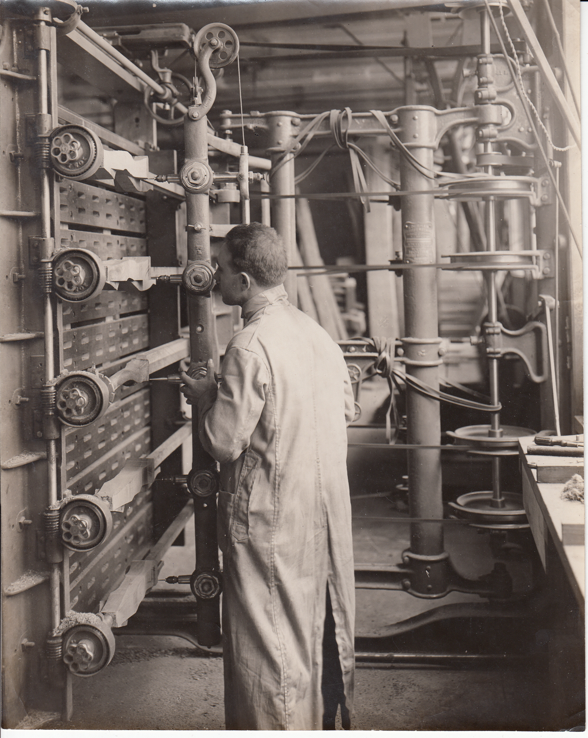 Worker making phonograph cabinet legs at Wisconsin Cabinet and Panel Co.