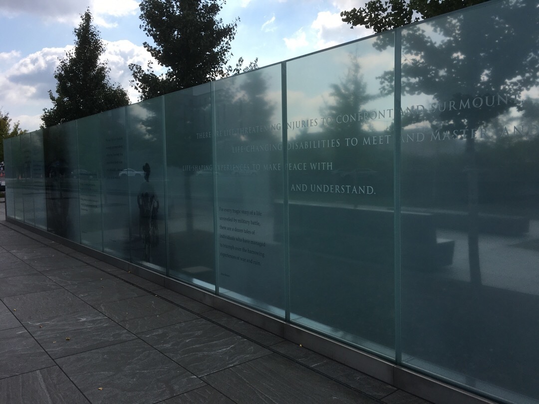 A glass wall with quotes on it to dedicate veterans disabled for life