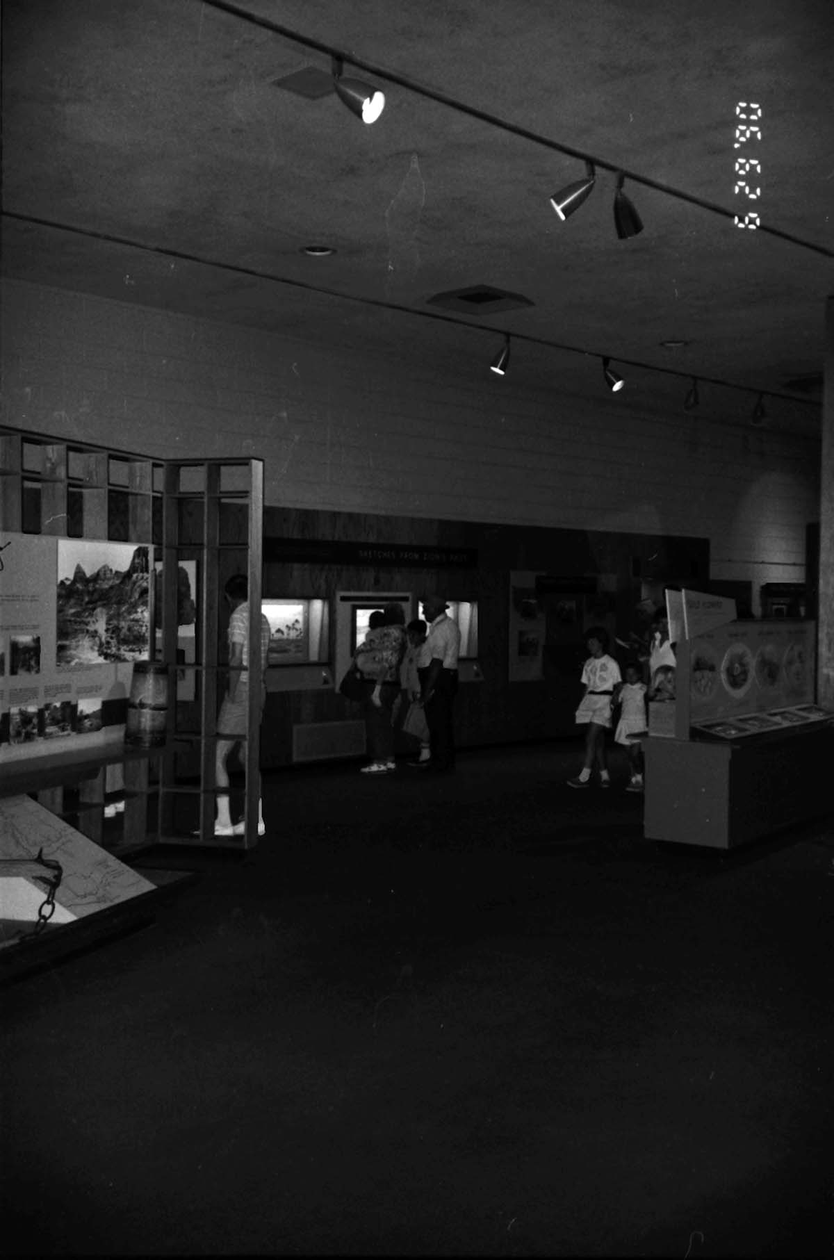 Visitors viewing the interpretive display in the old Mission 66 Visitor Center and Museum.