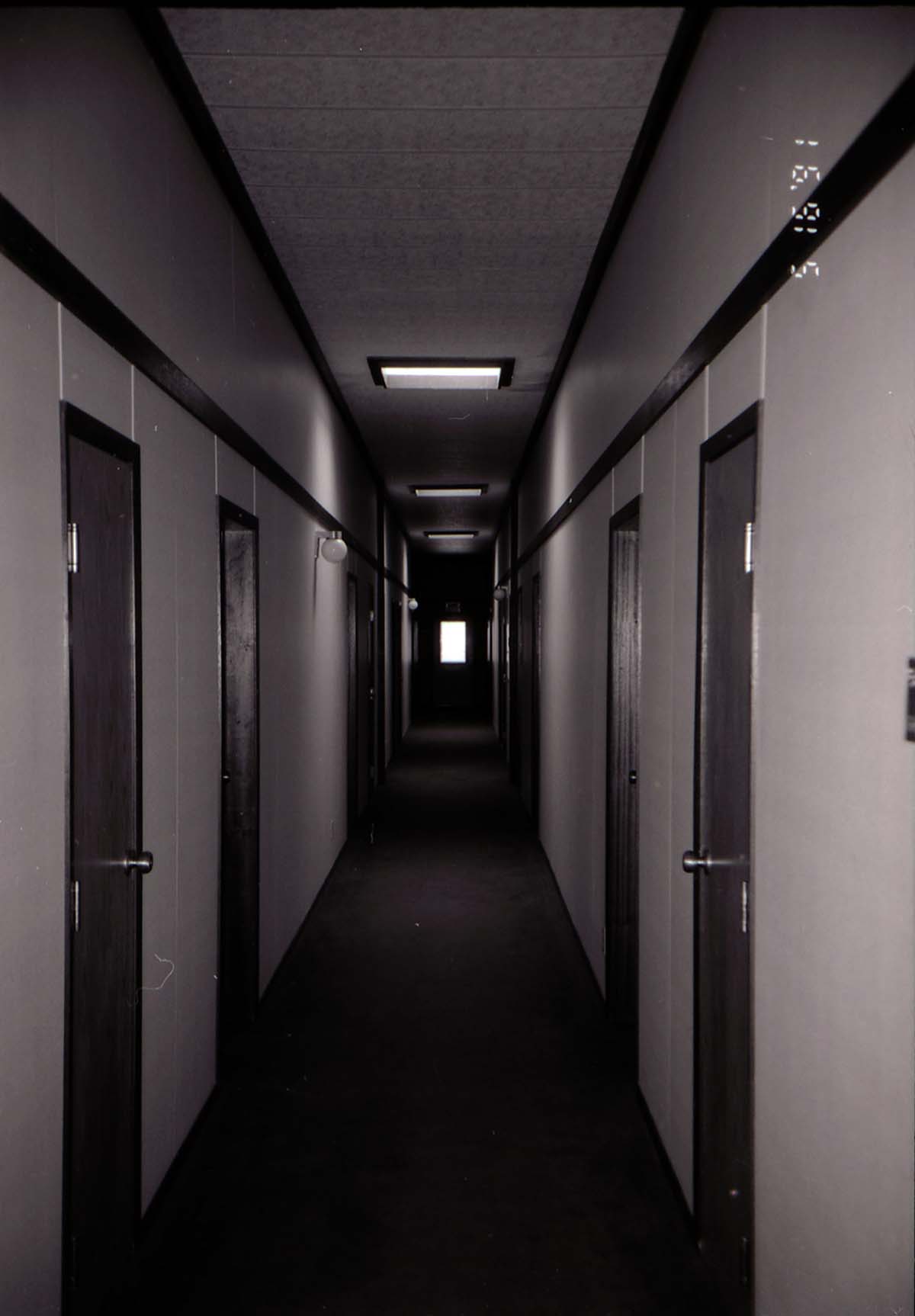 Hallway in barracks. [Image possibly for comparative housing study]