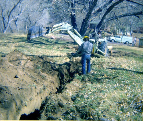 Construction vehicles and workers during the Zion Lodge utilities project.