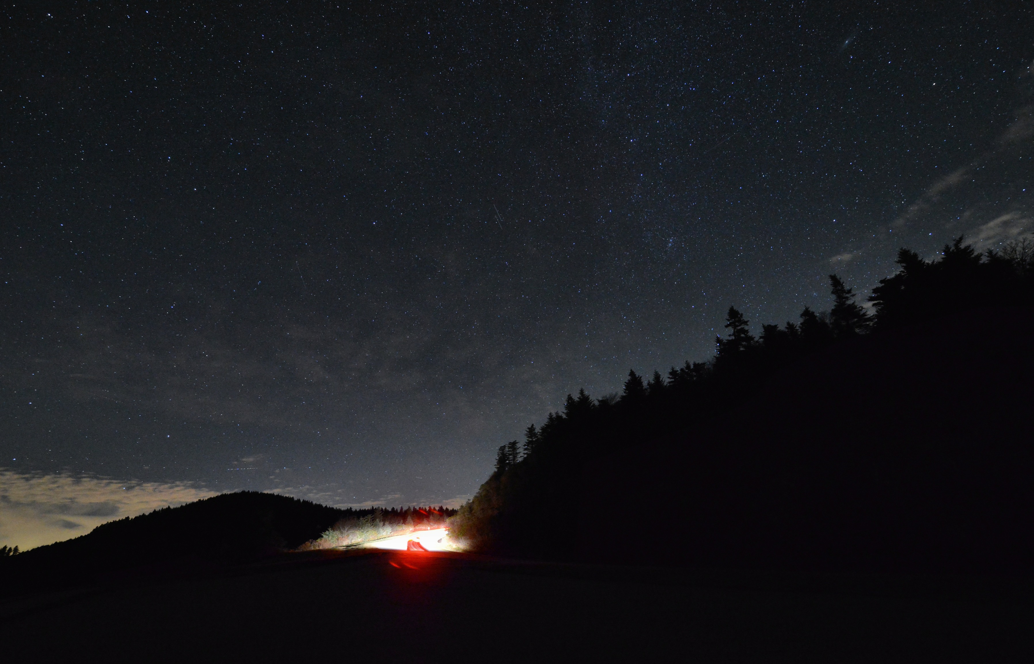 Cars driving down the parkway at night