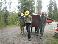 Yellowstone YCC installing a Food Storage Box (Bear Box) at Norris Campground in Summer 2014.. Yellowstone YCC enrollees installing a bear box at Norris Campground in Summer 2014. Each campsite now has a bear box for campers to store their food, coolers, and stoves.