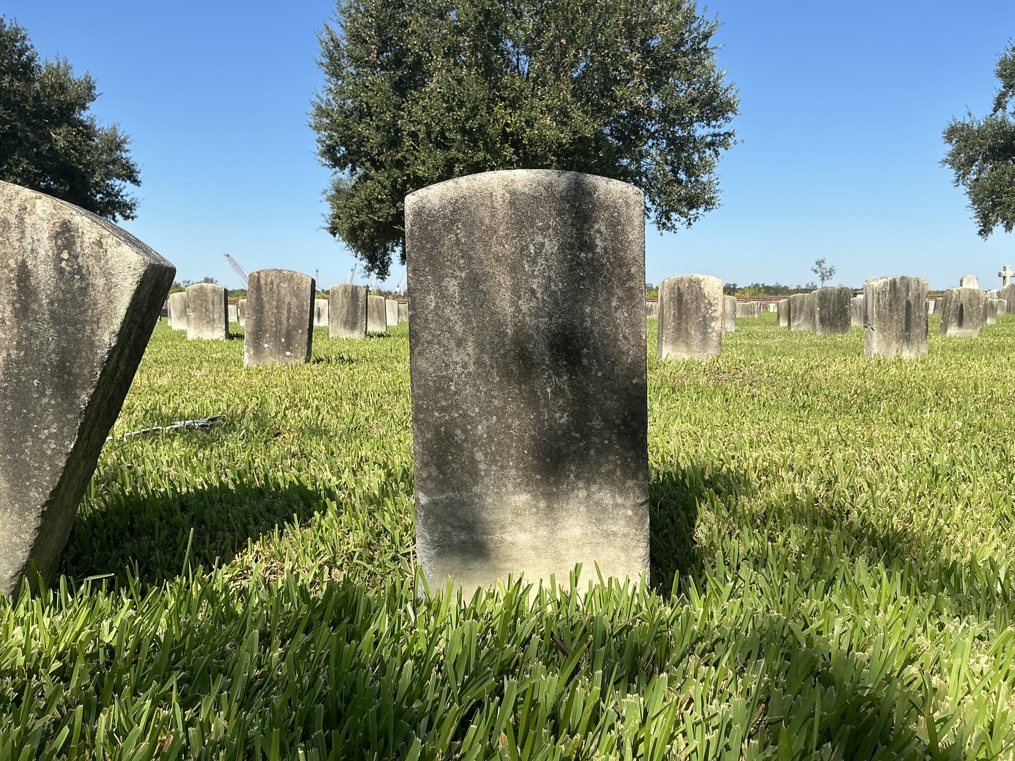 Back of historic upright marble headstone