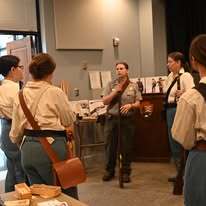 Union soldier and staff member holding muskets.