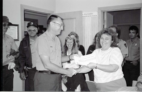 BW Photos of Superintendent Harold Grafe giving out awards to park personnel.