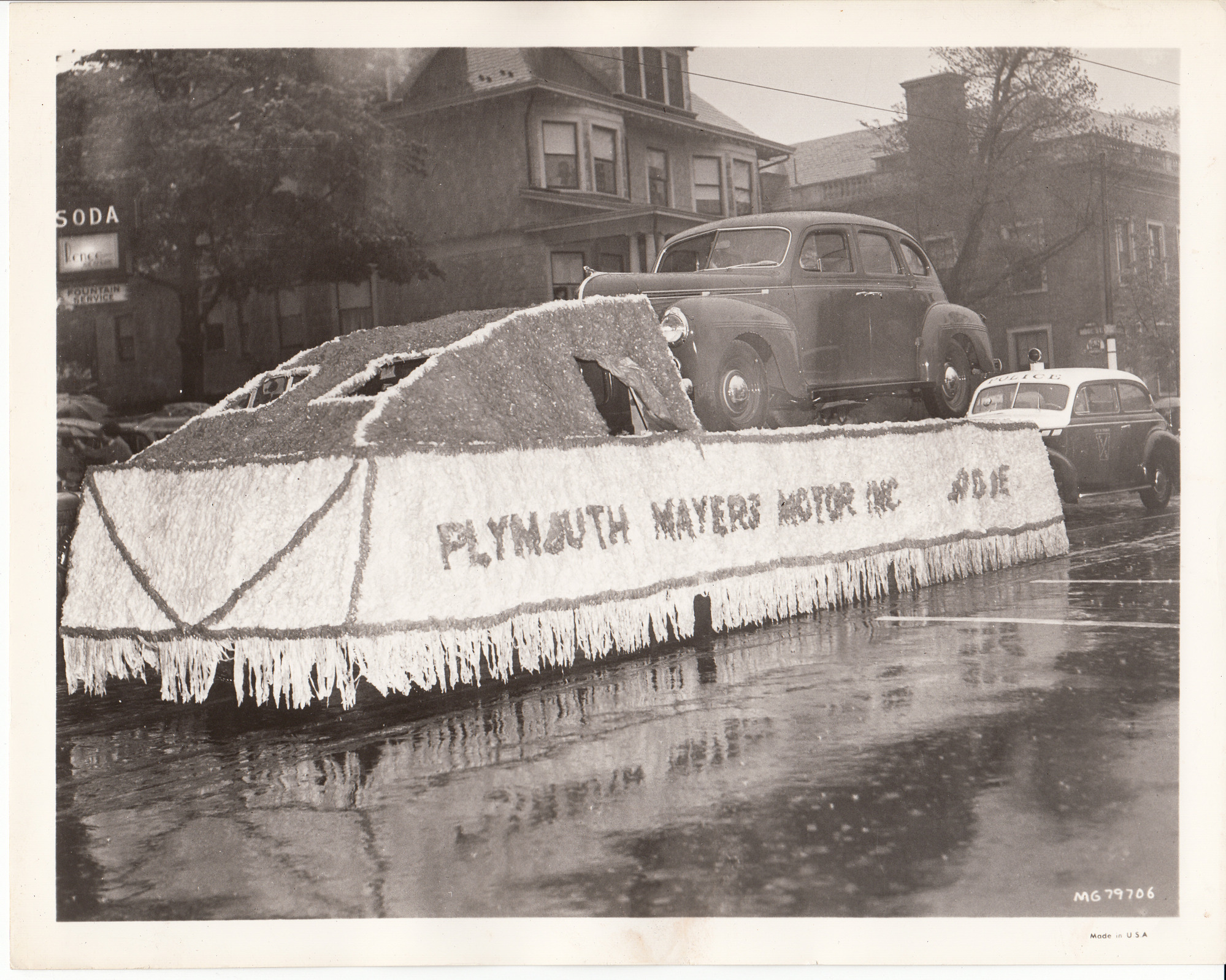 Plymouth Mayers Motor Inc. Float in parade going down Main St. near Ridge St. in West Orange, NJ at the premiere of "Edison, the Man."