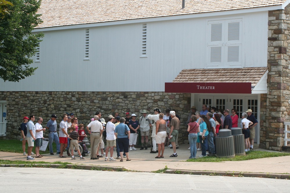 Park rangers lead walking tours from the park theater to the soldier cabins.