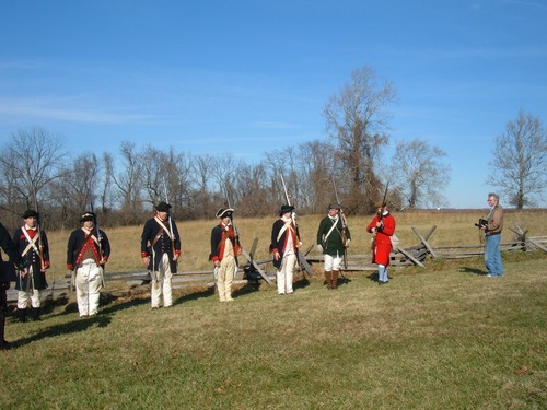Soldiers preparing for inspection. Soldiers are falling in and preparing for inspection before a demonstration.