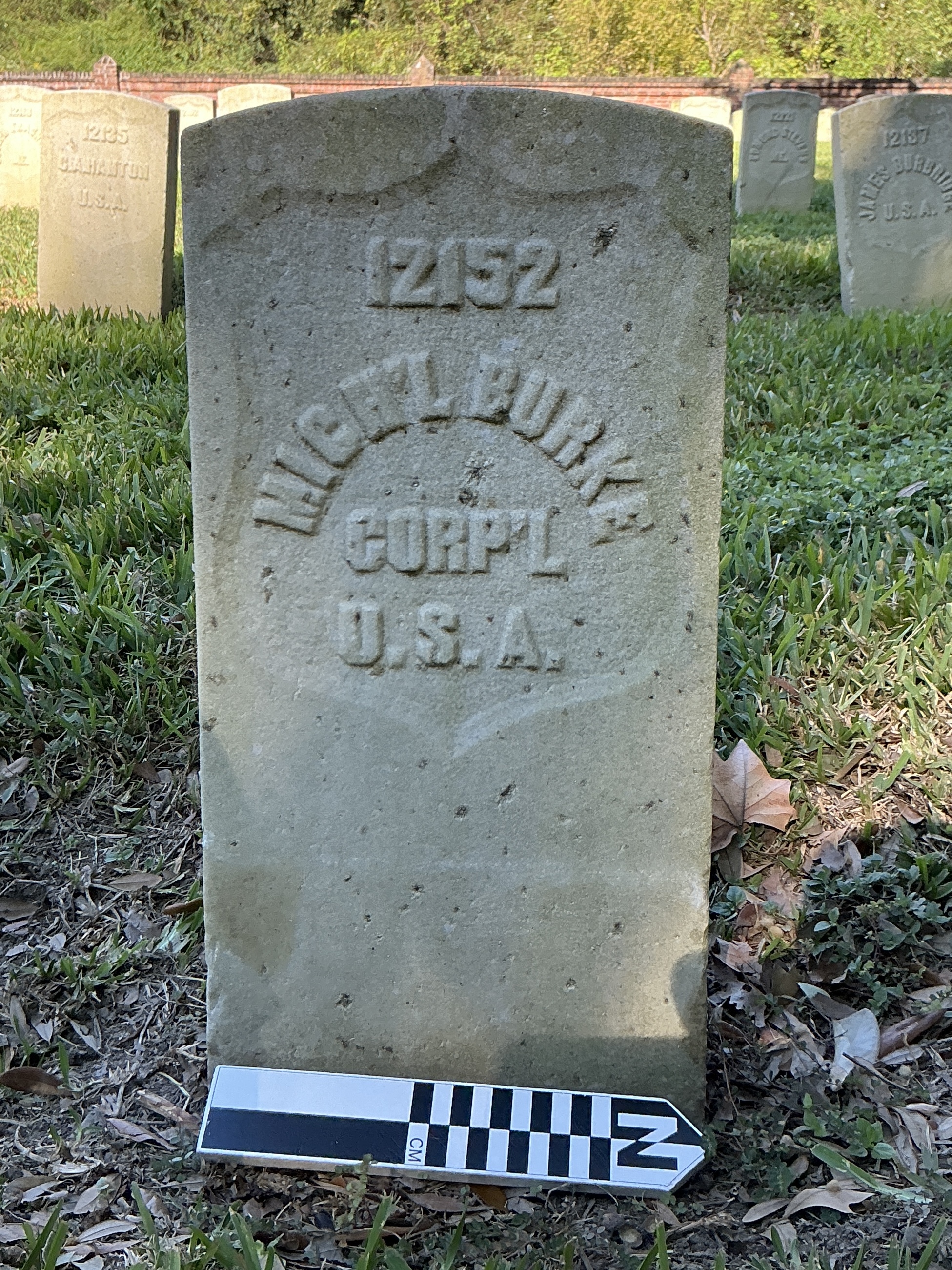 Extra image of historic upright marble headstone with recessed shield face.