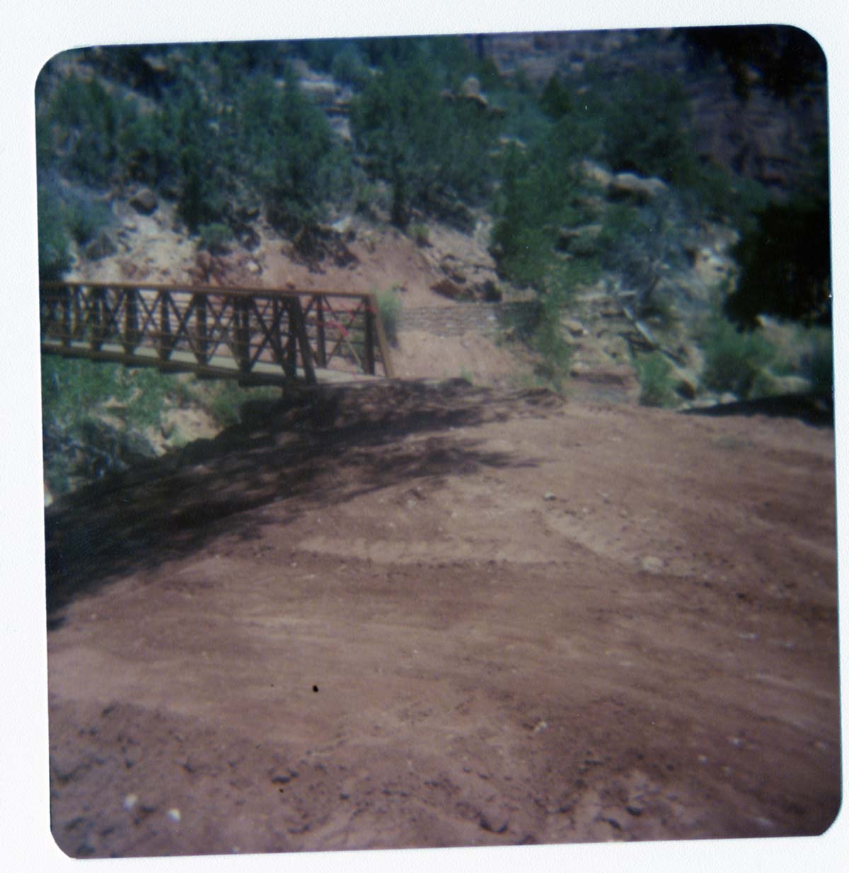 Dirt road leading up to the Zion Lodge footbridge during emplacement.