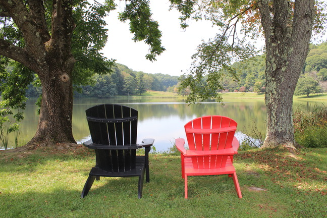 Chairs sitting at a lake