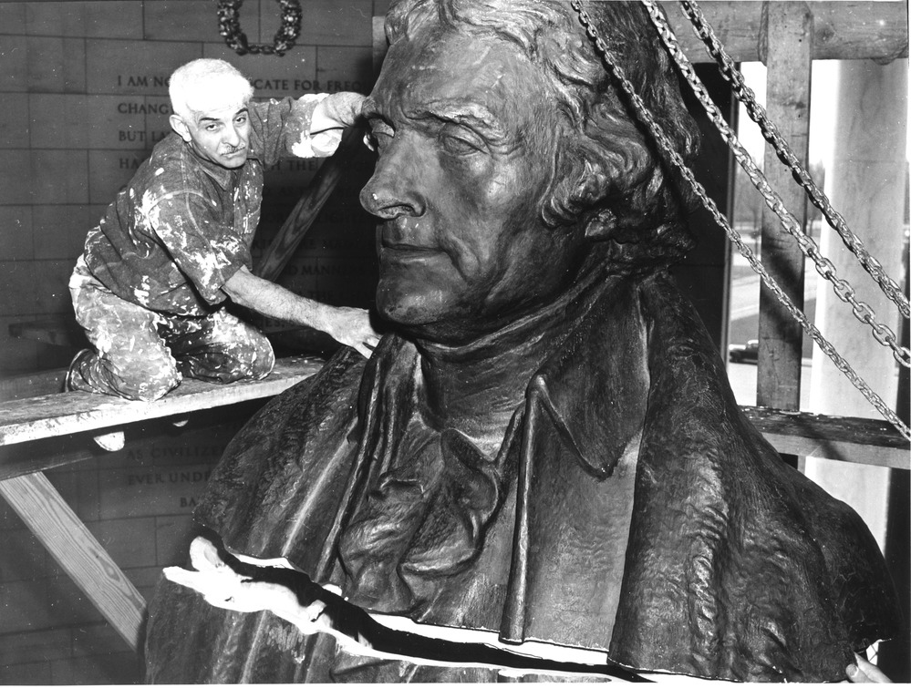 The temporary plaster statue of Thomas Jefferson is disassembled in the Jefferson Memorial prior to the permanent bronze statue being installed.